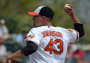 orioles pitcher johnson arm back behind head before throwing pitch