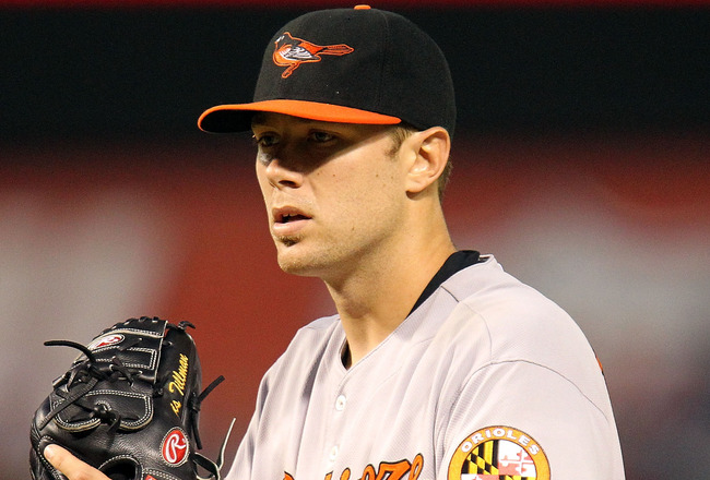 close up of orioles pitcher holding baseball glove