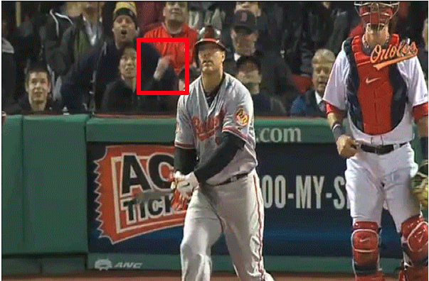 orioles player and catcher in front of fans in stand