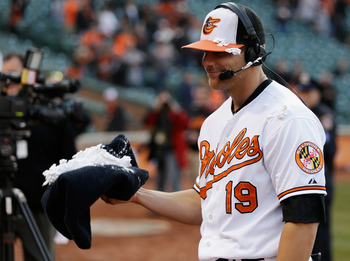 orioles player holding pie in hand