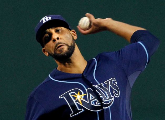 tampa bay rays player with arm behind back before throwing pitch