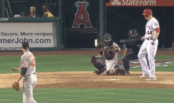 angels baseball palyer looking back at catcher at home plate