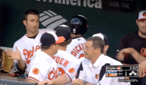 orioles players huddled around in dugout