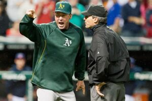 athletics manager yelling and pointing at referee