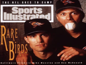 two orioles players on cover of sports illustrated one with baseball in mouth