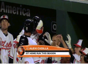 screenshot on tv of orioles players in dugout