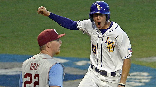isu baseball player with arm up and mouth open cheering