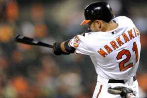 orioles markakis with bat in front of him after hitting baseball