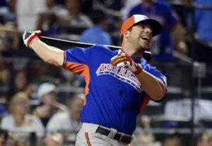 baseball player holding bat behind head after hitting ball