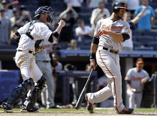 orioles batter in front of yankees catcher