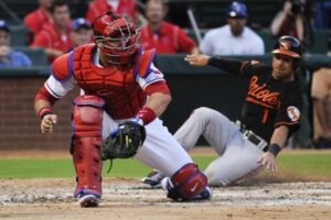 orioles roberts sliding into home plate by other player