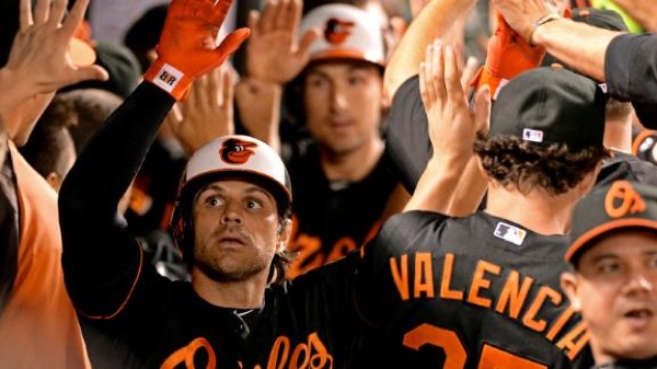 group of orioles players giving high five
