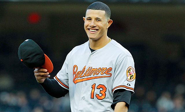 orioles manny machado holding hat and smiling