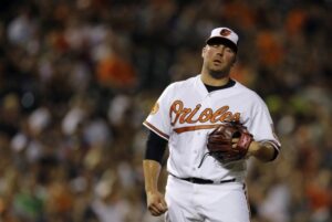 baltimore orioles player with eyes closed and mouth open looking frustrated