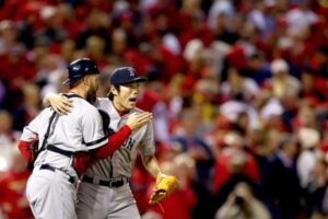 boston pitcher hugging boston red sox catcher