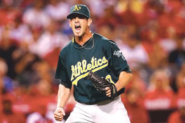 oakland athletics player with fists clenched screaming