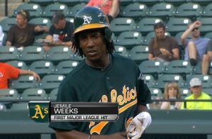 still shot of athletics player in front of people in stands