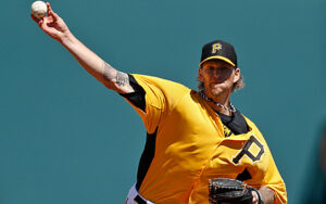 pittsburg pirates pitcher with arm up before throwing pitch