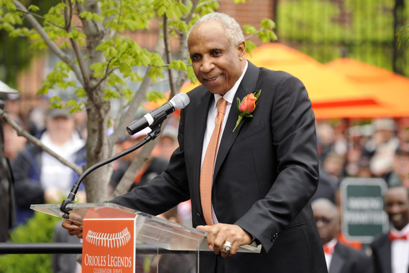 former oriole player standing at podium smiling