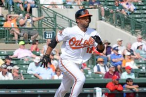 orioles player running after hitting baseball