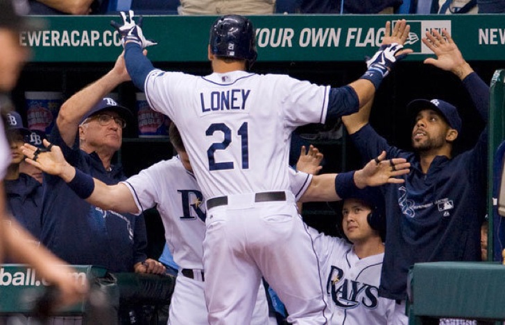 tampa bay player slapping hands going into dugout