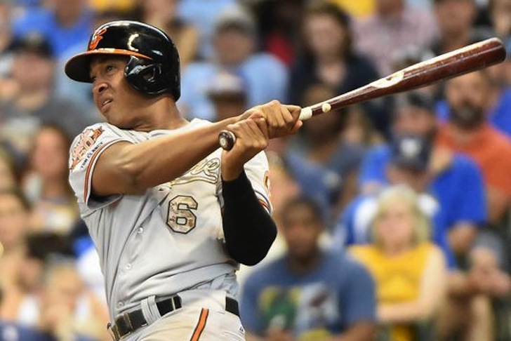 orioles baseball player looking out to field after hitting ball