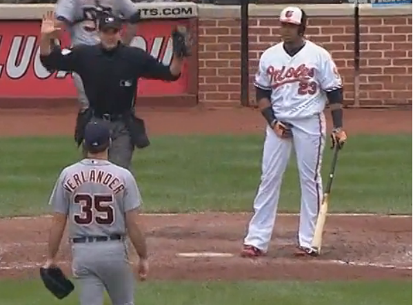 orioles player at home base grabbing crotch