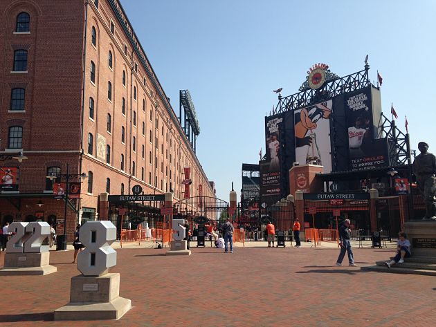 partial view of brick building and entrance to camden yards