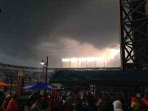 view of stadium at night with bright lights on