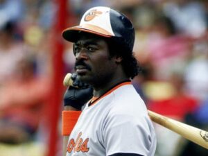 former orioles player holding baseball bat behind shoulder