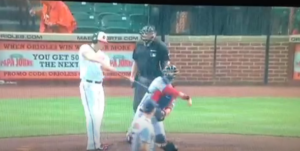 batter during game with catcher and referee behind