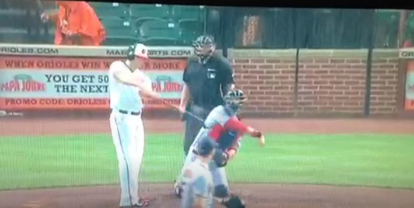 batter during game with catcher and referee behind