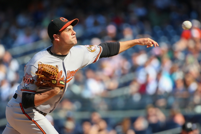 pitcher for baltimore orioles arm extended after releasing pitch