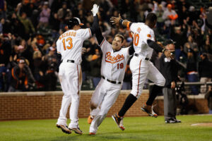three orioles players giving each other high fives