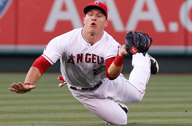 angels player falling on field catching baseball