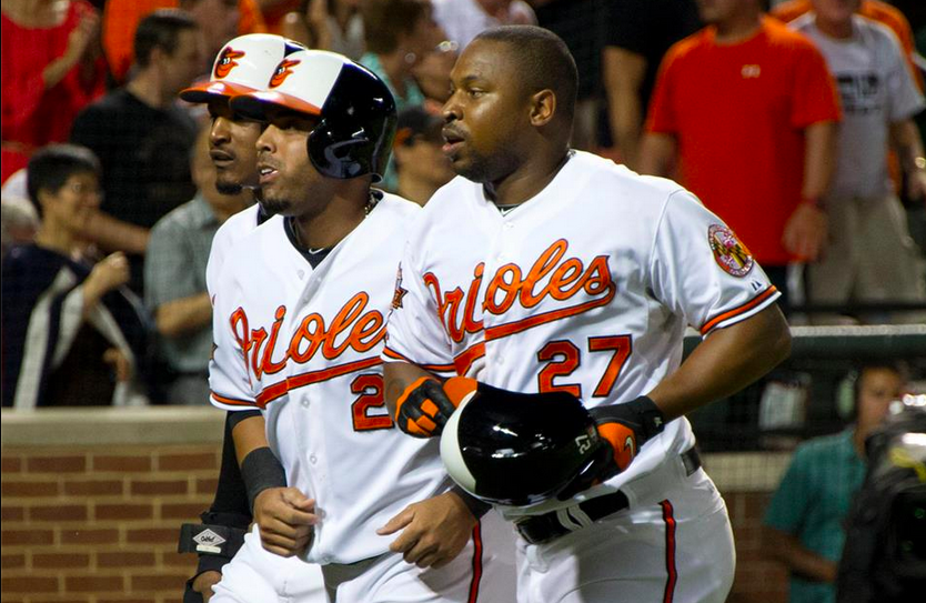 three orioles players running side by side