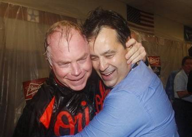 close up of buck showalter orioles manager hugging guy in celebration
