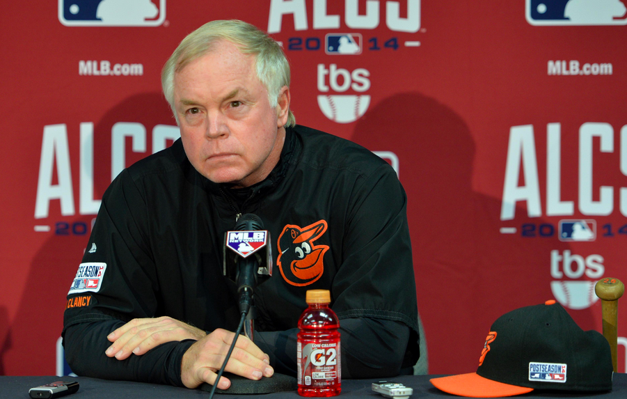 orioles manager sitting in front of microphone during press conference