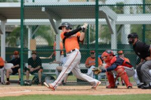 jonah heim batting for orioles with catcher and referee behind him