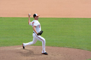 orioles player matusz with arm back about to throw pitch