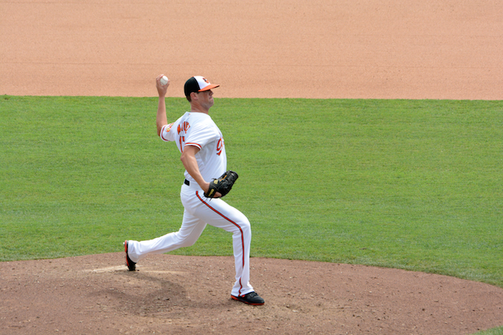 orioles player matusz with arm back about to throw pitch