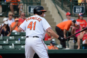 baseball player blowing bubble gum while up to bat