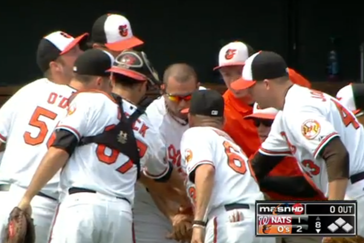 baltimore orioles baseball team in a huddle at game