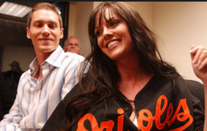 kris benson next to wife wearing orioles shirt