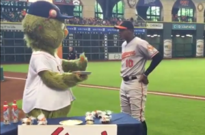 oriole player about to get pie in face by mascot