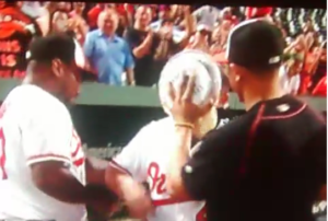 orioles player getting pie in face by two other team members
