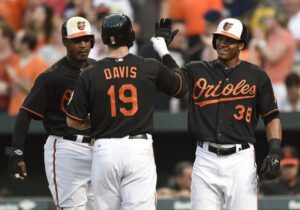 three orioles players giving high five