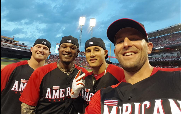 four all star players posed together with stadium crowd in background