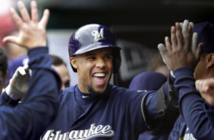 carlos gomez high fiving team members in dugout