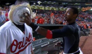 Henry Urrutia getting pie in face by team member after hitting first walk-off home run.